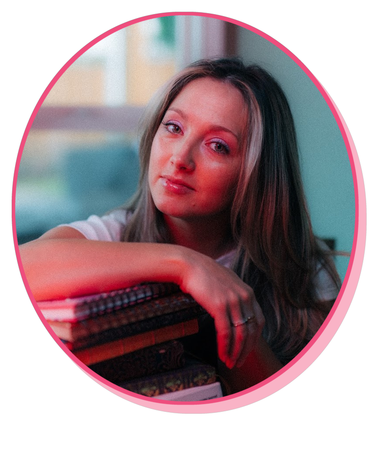 Megan Monty with a stack of books
